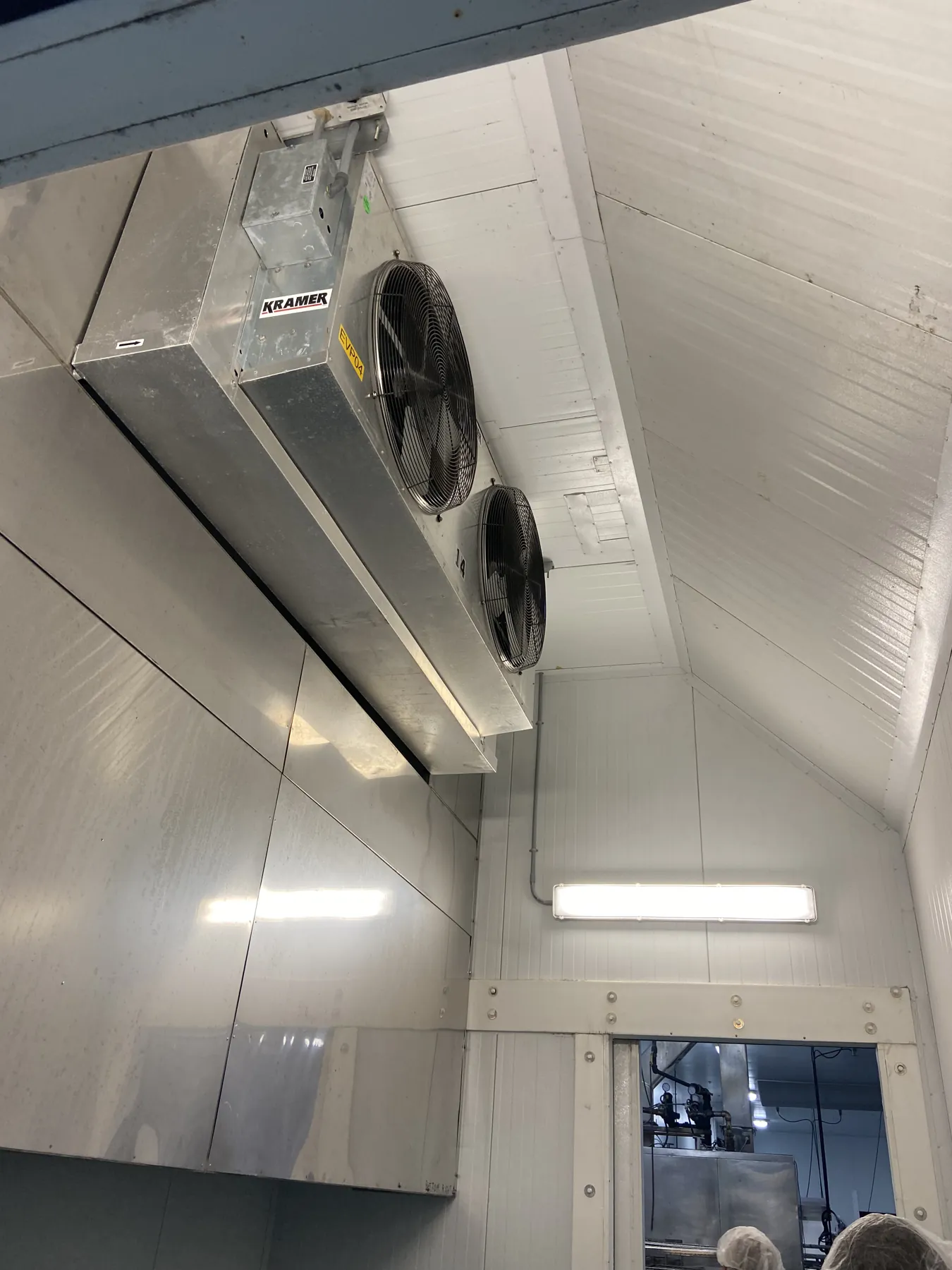 Close-up of a walk-in cooler evaporator coil unit